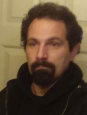 A person with a beard and mustache

AI-generated content may be incorrect.